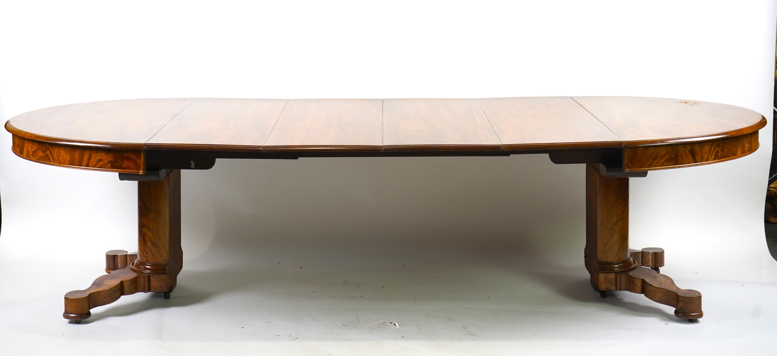 A mid 19th century Continental mahogany extending dining table